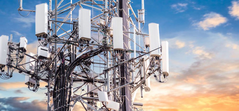 5G Sunset Cell Tower: Cellular communications tower for mobile phone and video data transmission